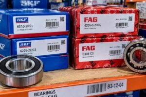 A close-up view of genuine SKF and FAG bearings with visible batch codes and traceability labels arranged on a warehouse shelf
