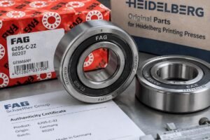 Close-up inspection of FAG bearings for Heidelberg printing presses with visible origin markings and packaging details