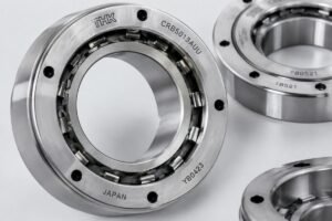Close-up view of high-precision cross roller bearings for robotic joints with visible original manufacturer markings